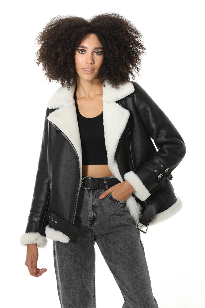 Woman wearing black shearling jacket