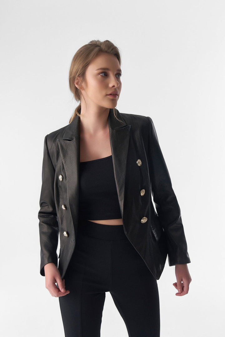 Woman wearing black leather blazer
