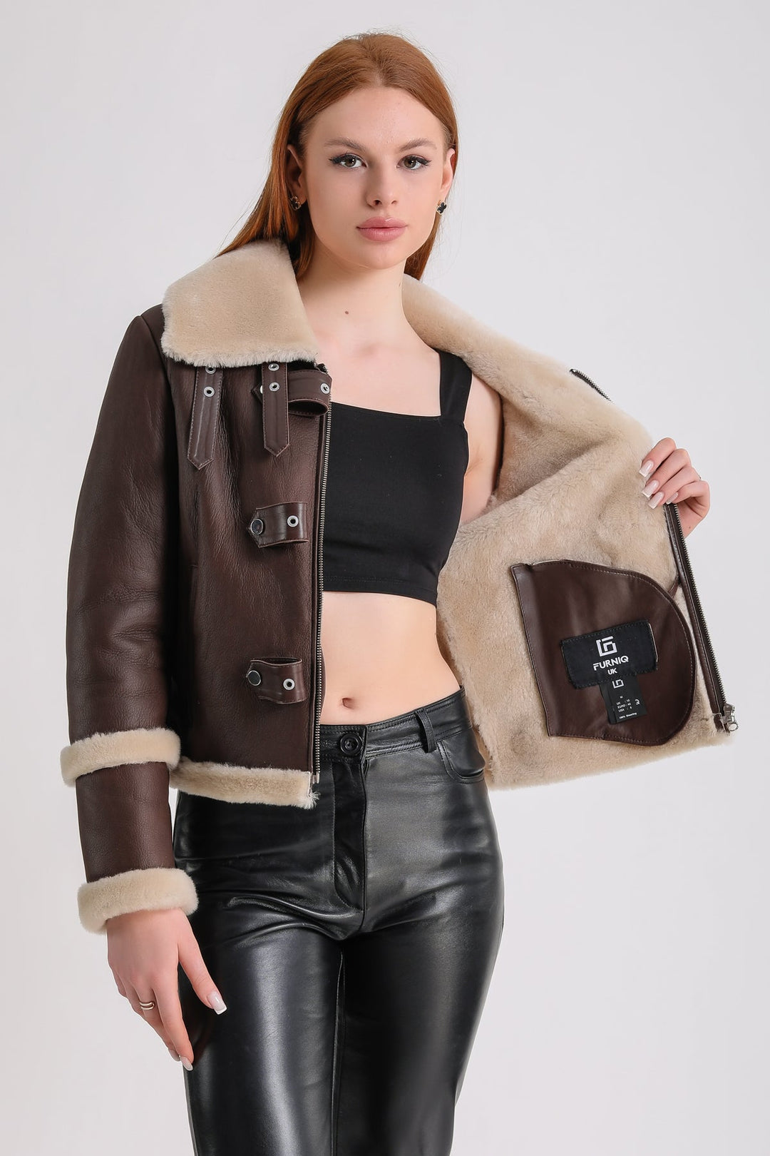 Brown shearling jacket on model