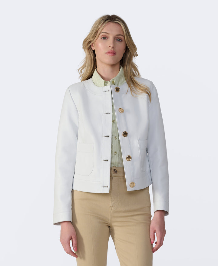 Woman wearing white leather jacket