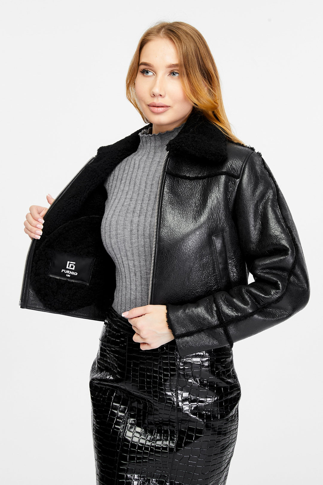 Woman wearing black shearling jacket