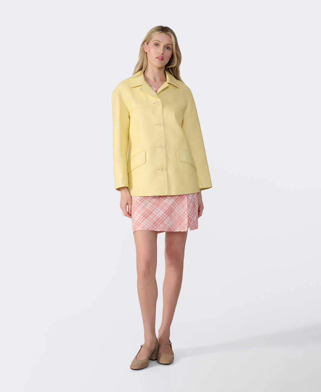 Female model in yellow leather jacket