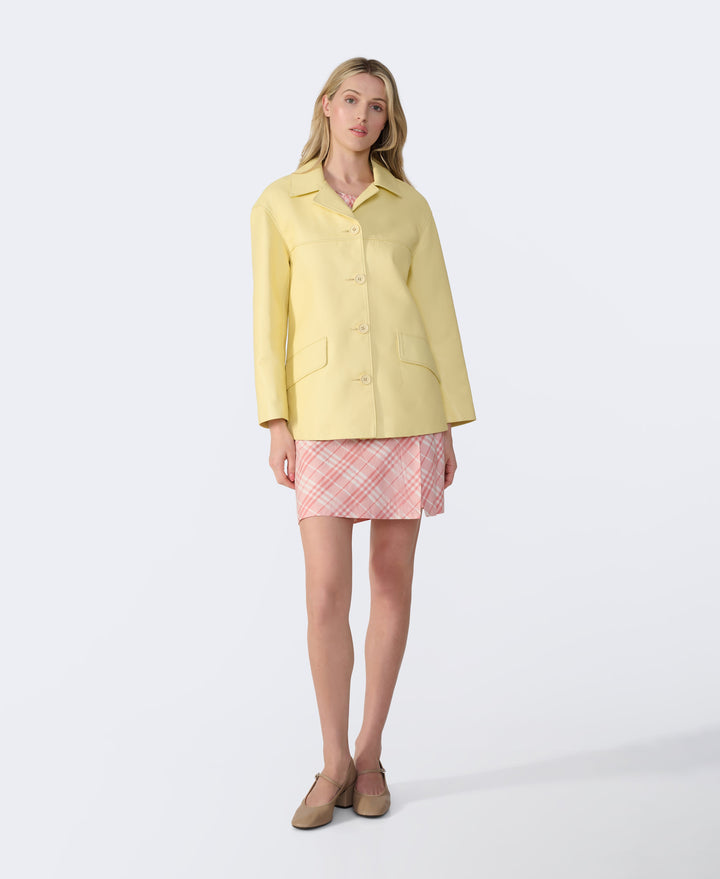 Female model in yellow leather jacket