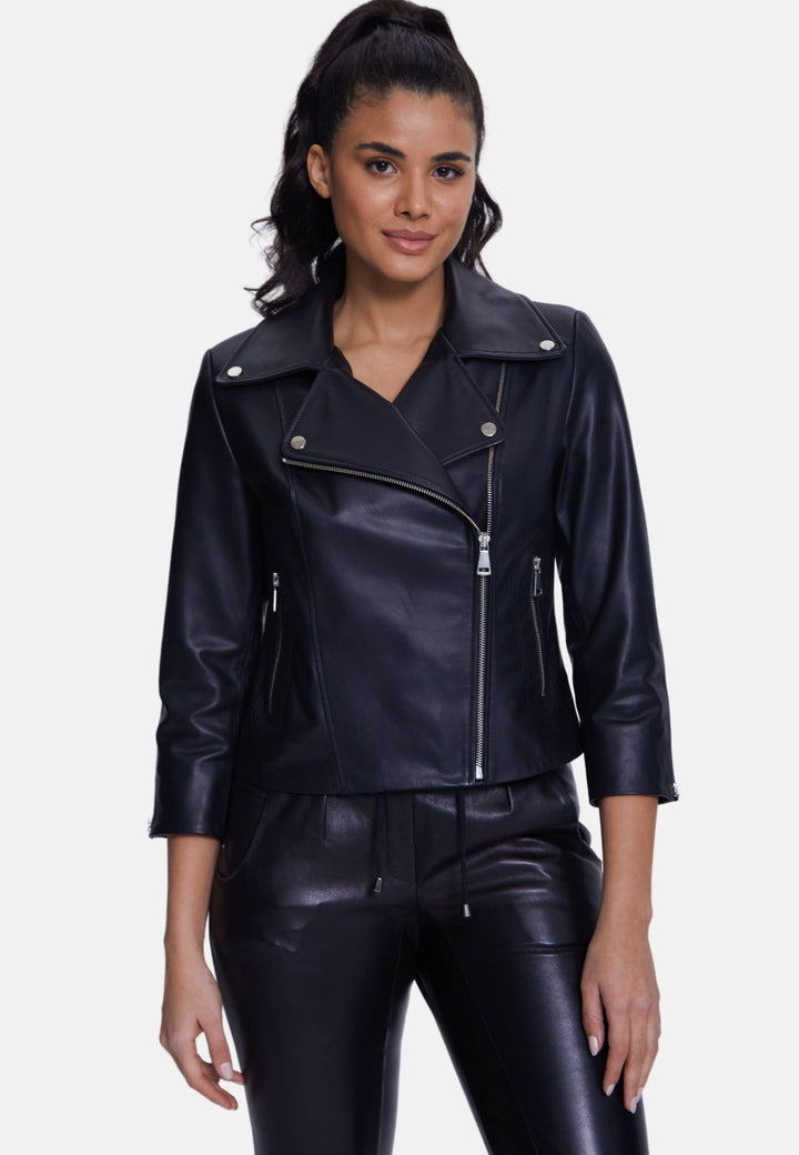 Woman wearing black leather biker jacket