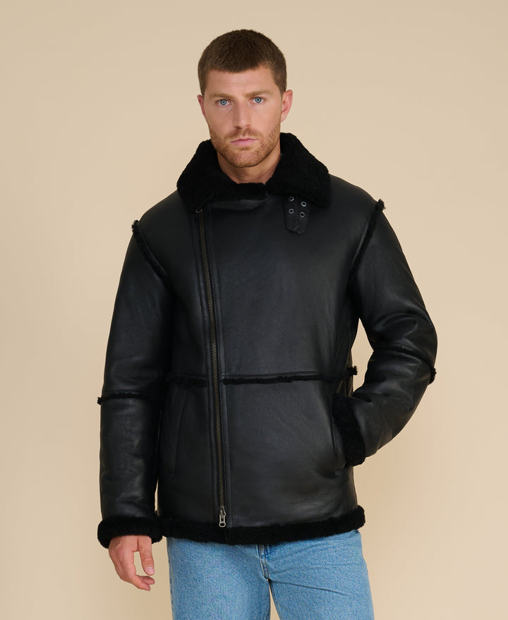 Male model wearing black shearling jacket