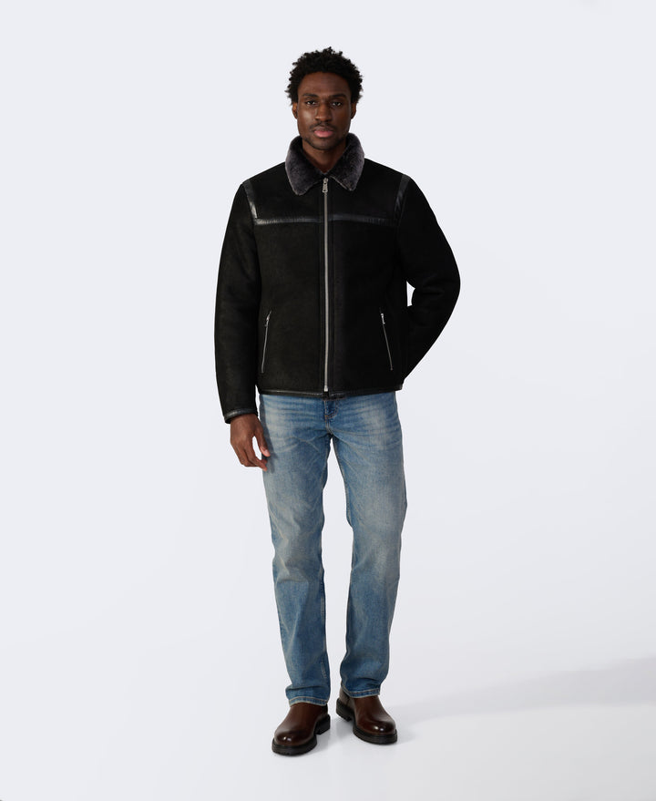 Man wearing black shearling jacket