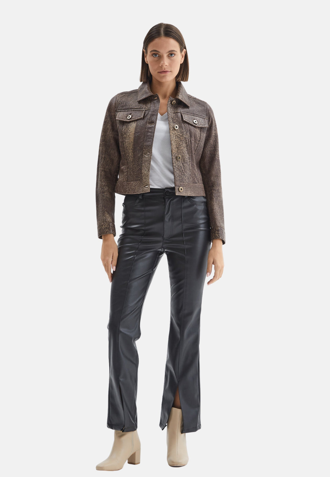 Woman wearing brown cropped leather jacket