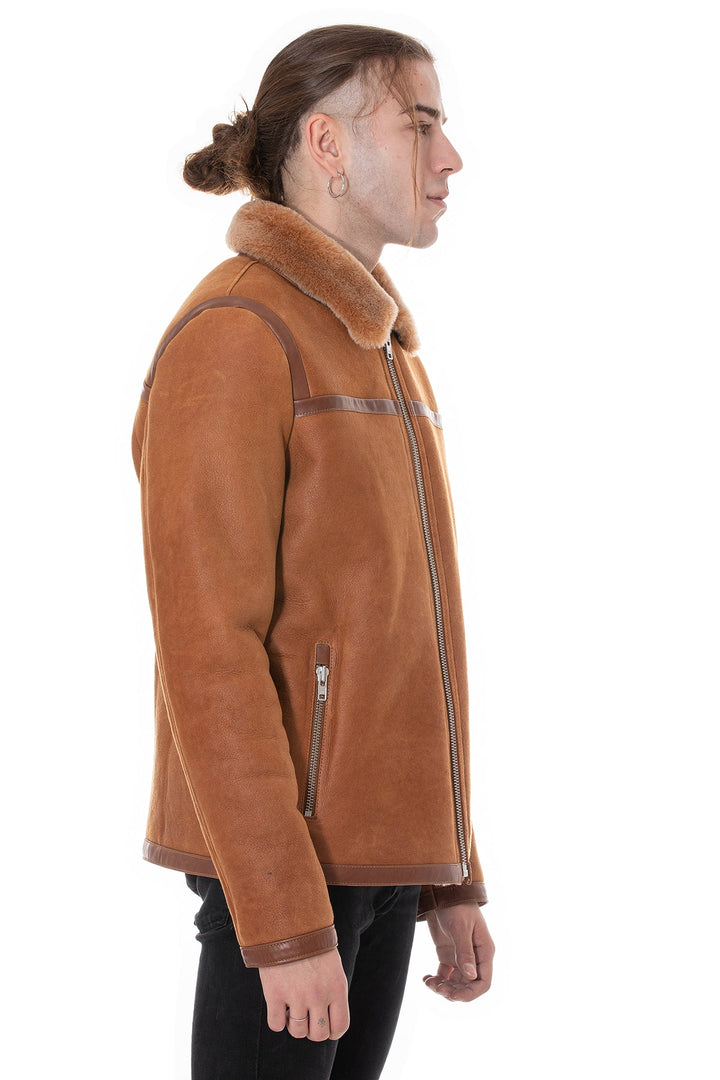Male model wearing tan shearling jacket