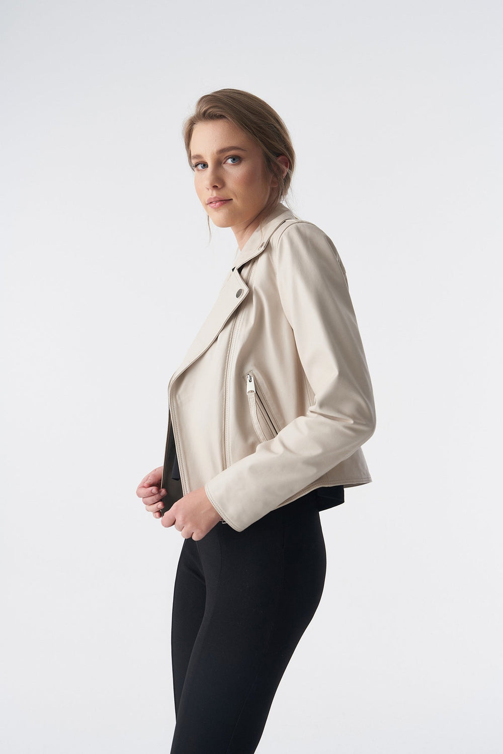 Woman wearing beige leather jacket