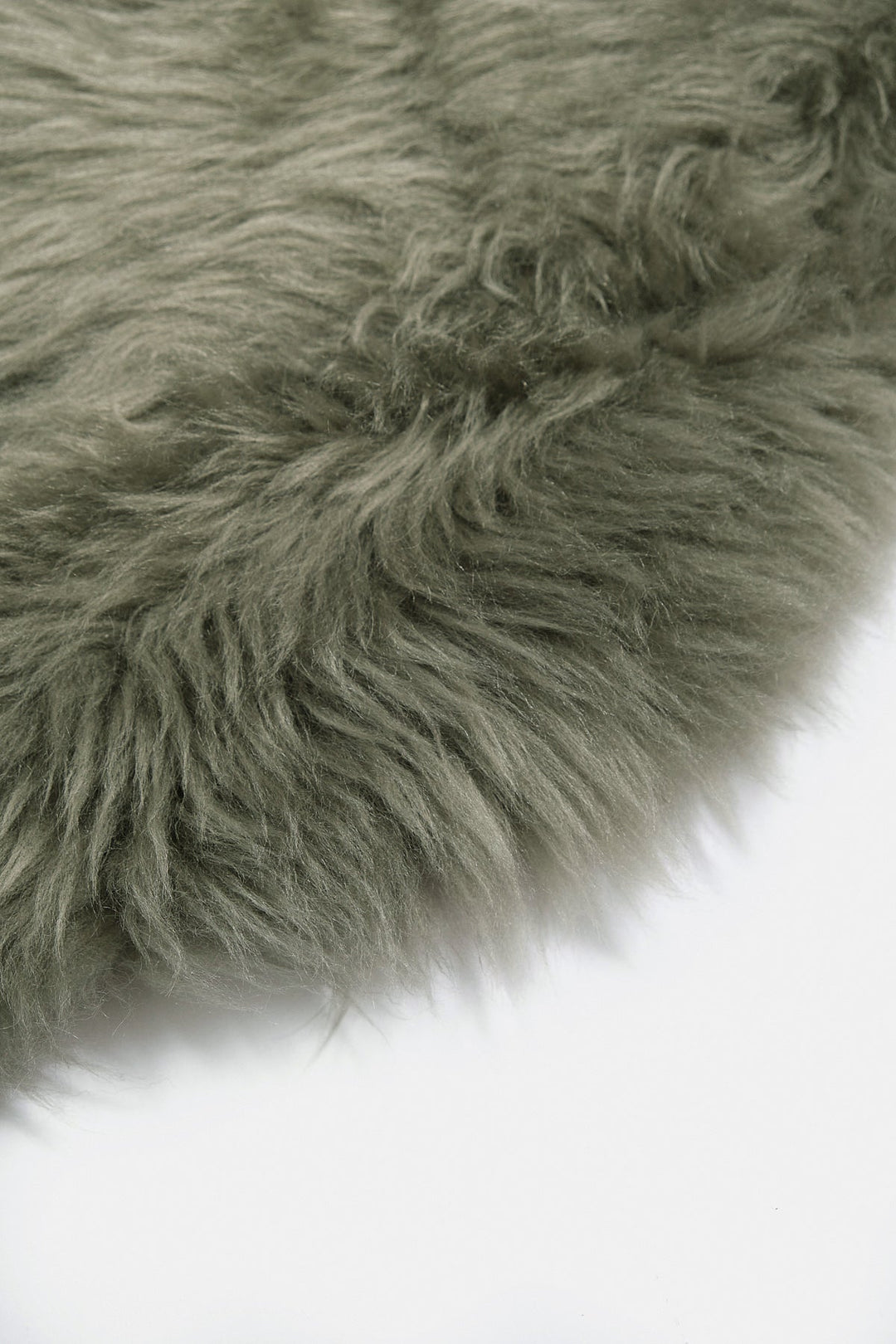 Light green fluffy sheepskin rug