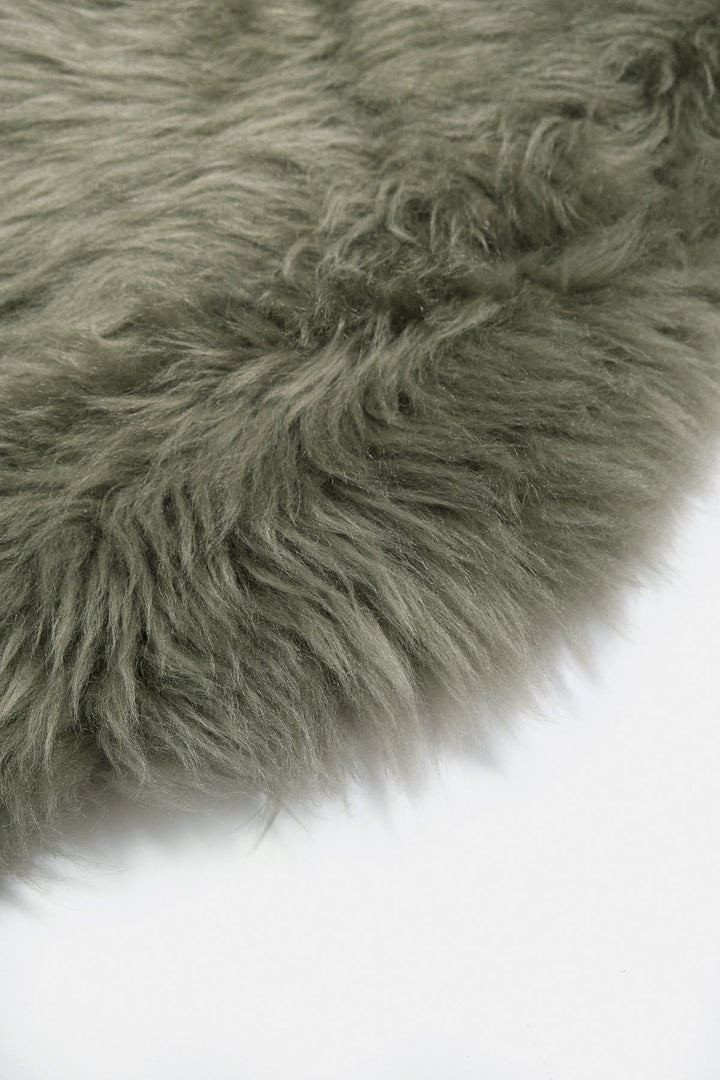 Light green fluffy sheepskin rug