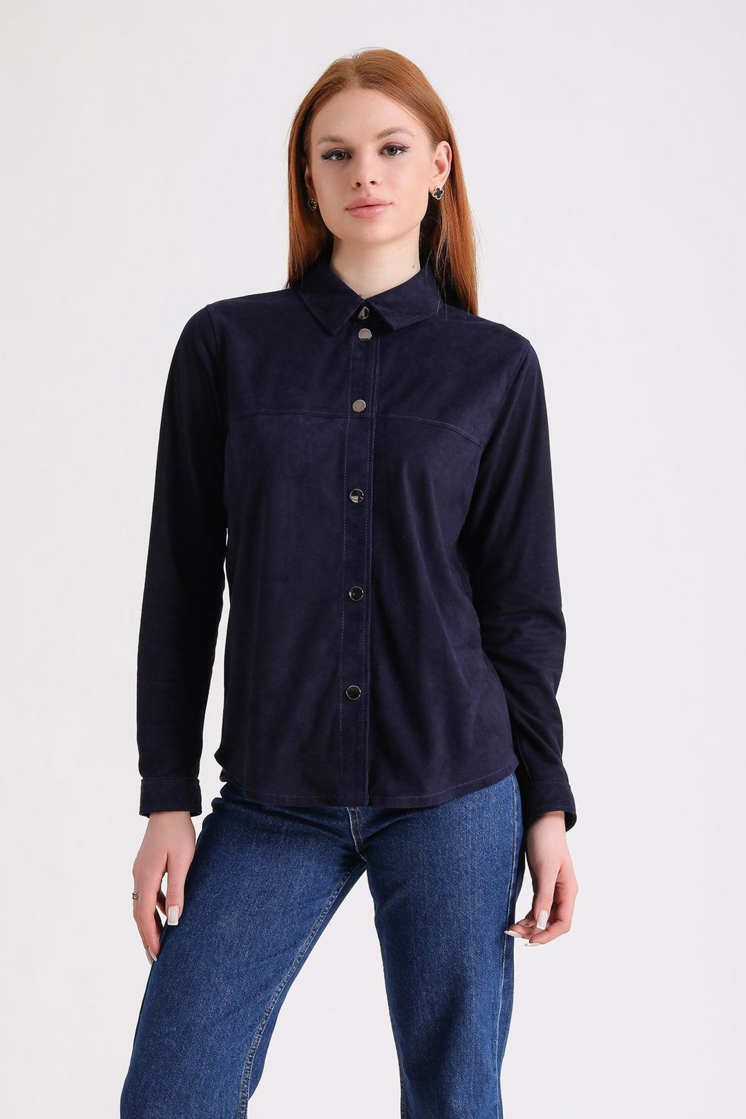 Woman wearing navy suede shirt