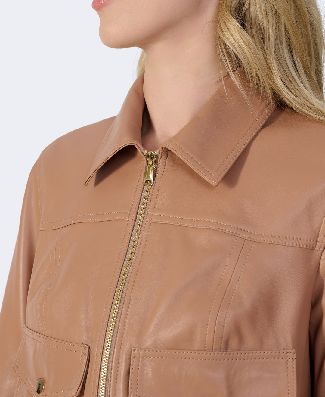 Close-up tan leather zip jacket