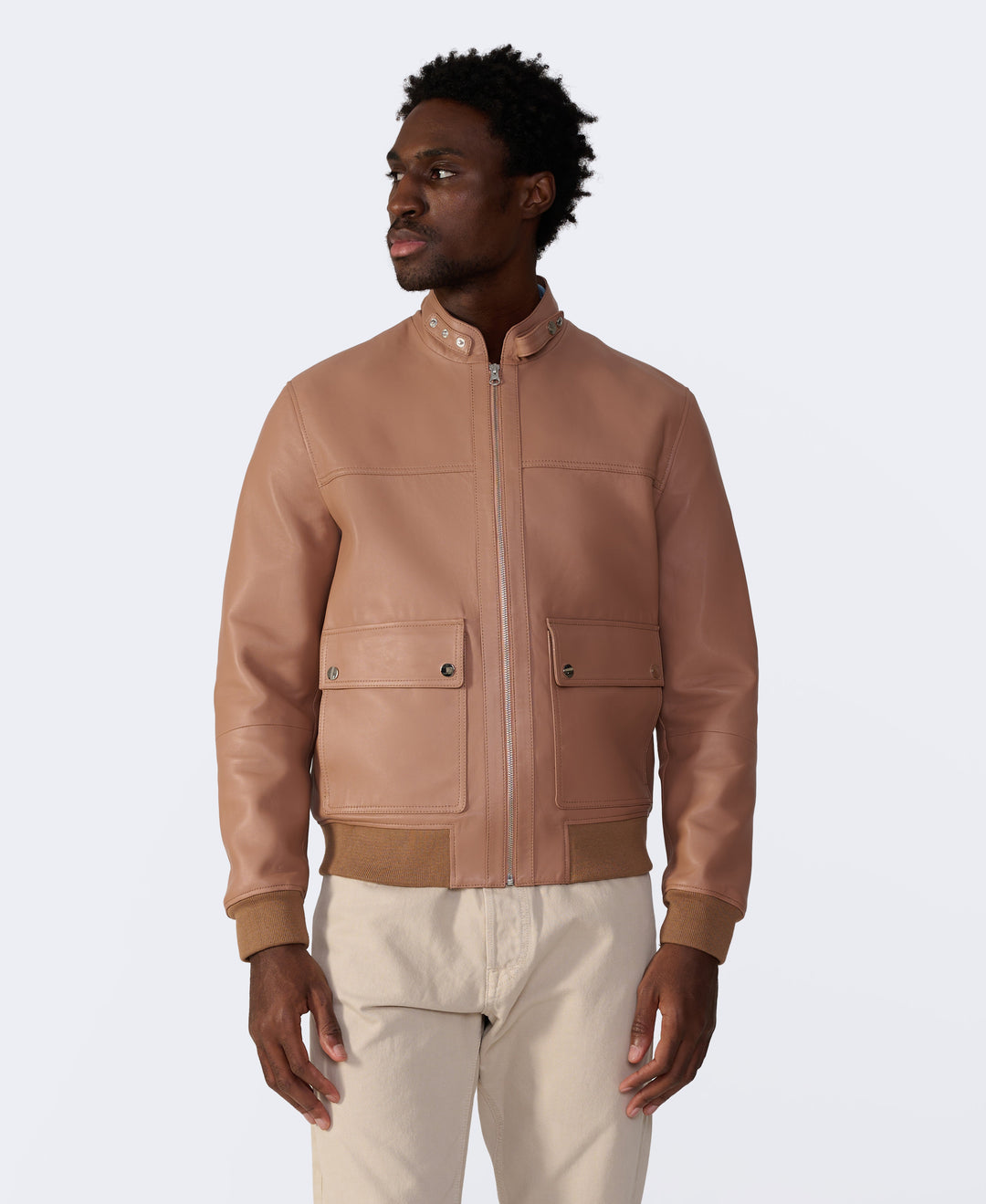 Tan leather bomber jacket on model