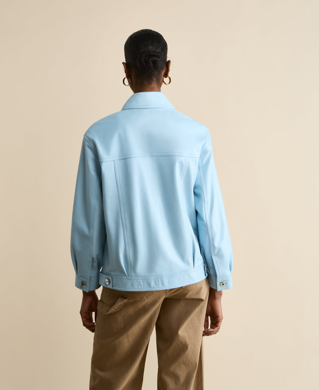Back view light blue leather jacket