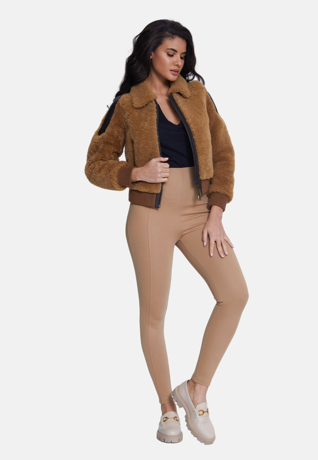 Woman wearing camel sheepskin teddy jacket