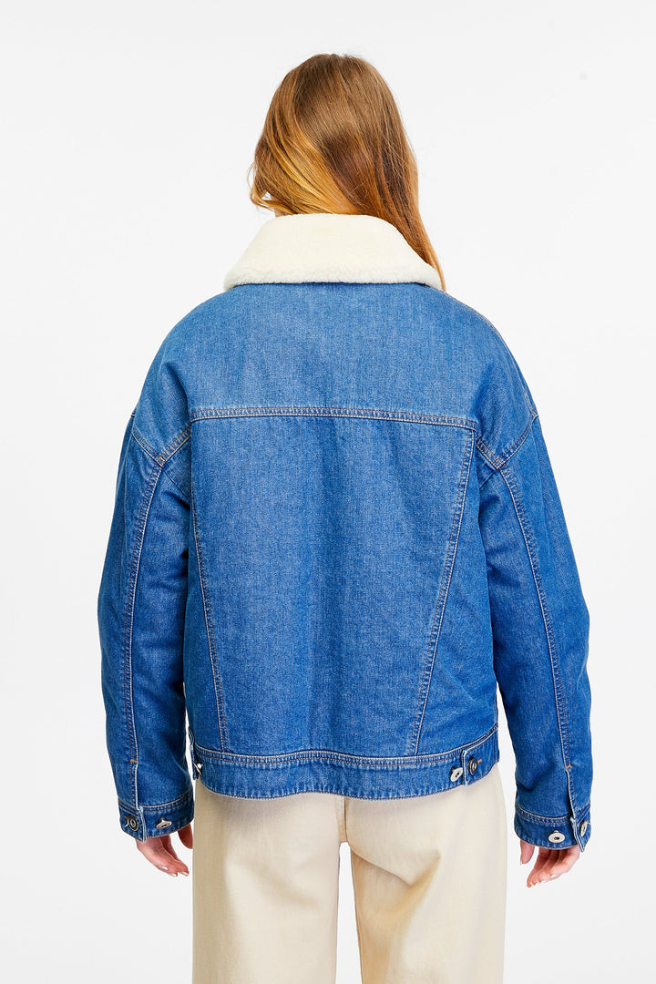 Blue denim jacket with white sherpa collar