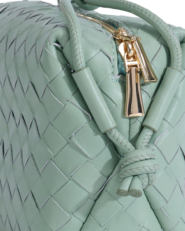 Pastel green woven leather crossbody bag