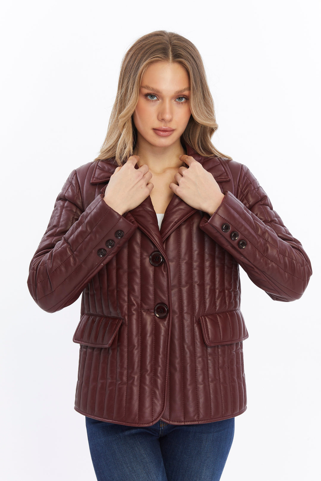 Woman wearing burgundy quilted leather coat