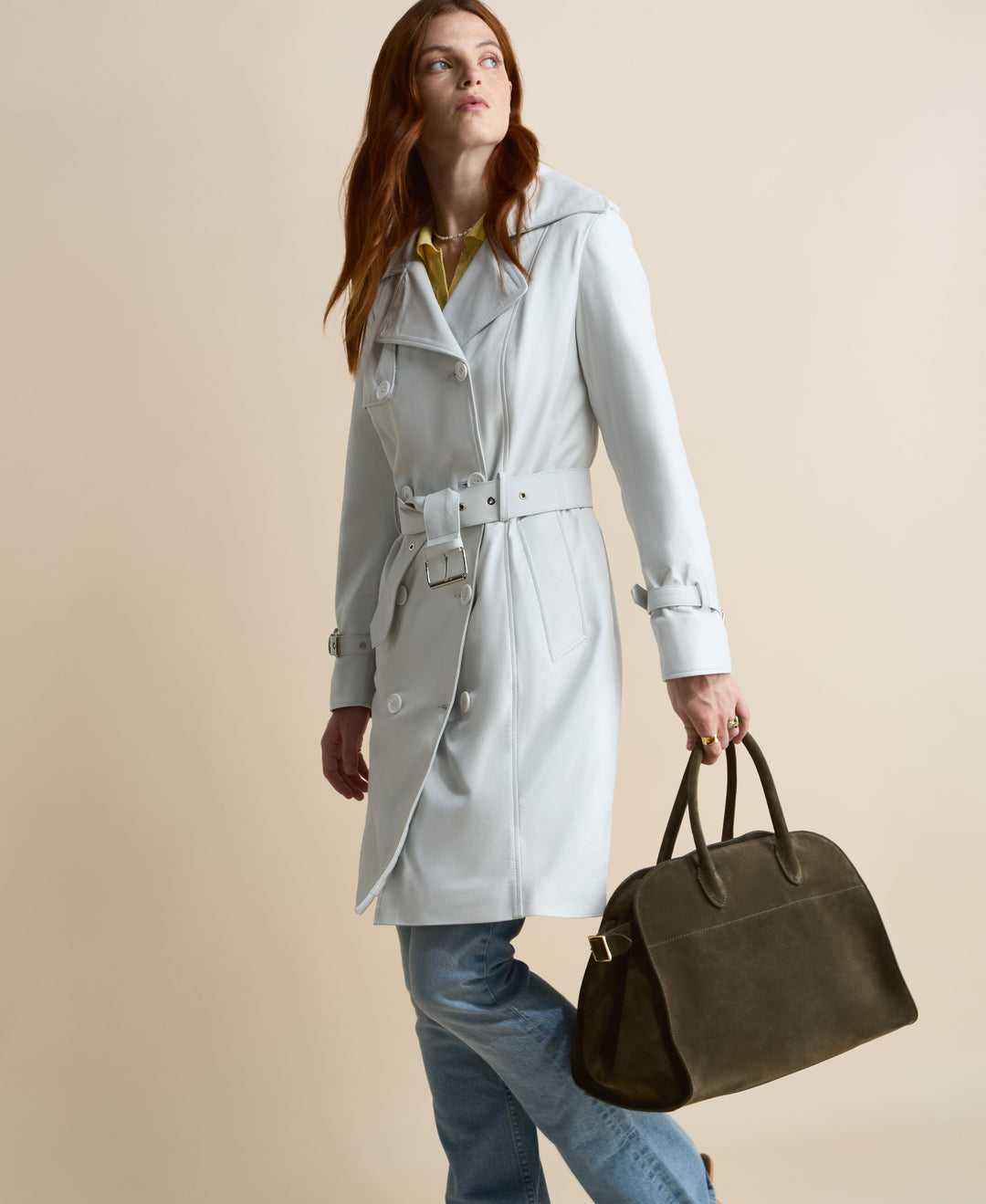 Light grey leather trench coat on model
