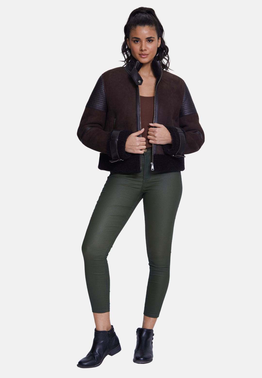 Woman wearing brown sheepskin bomber jacket