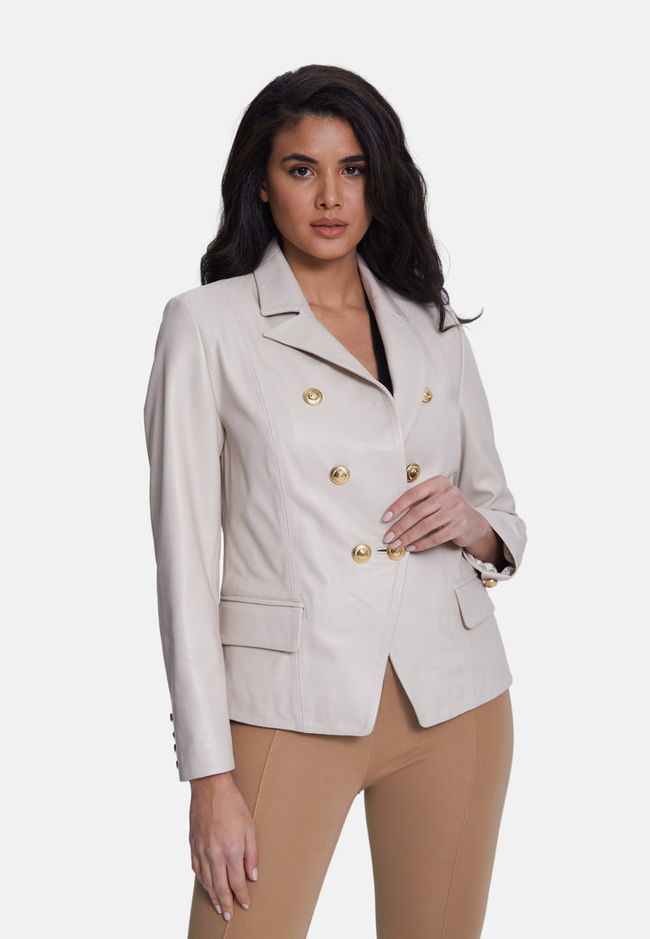 Woman wearing beige leather blazer