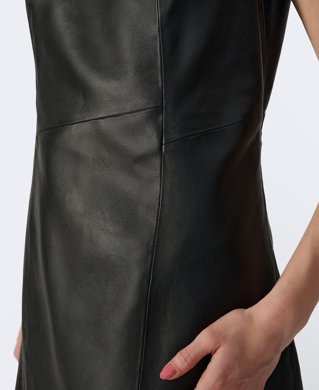 Close-up of black leather dress