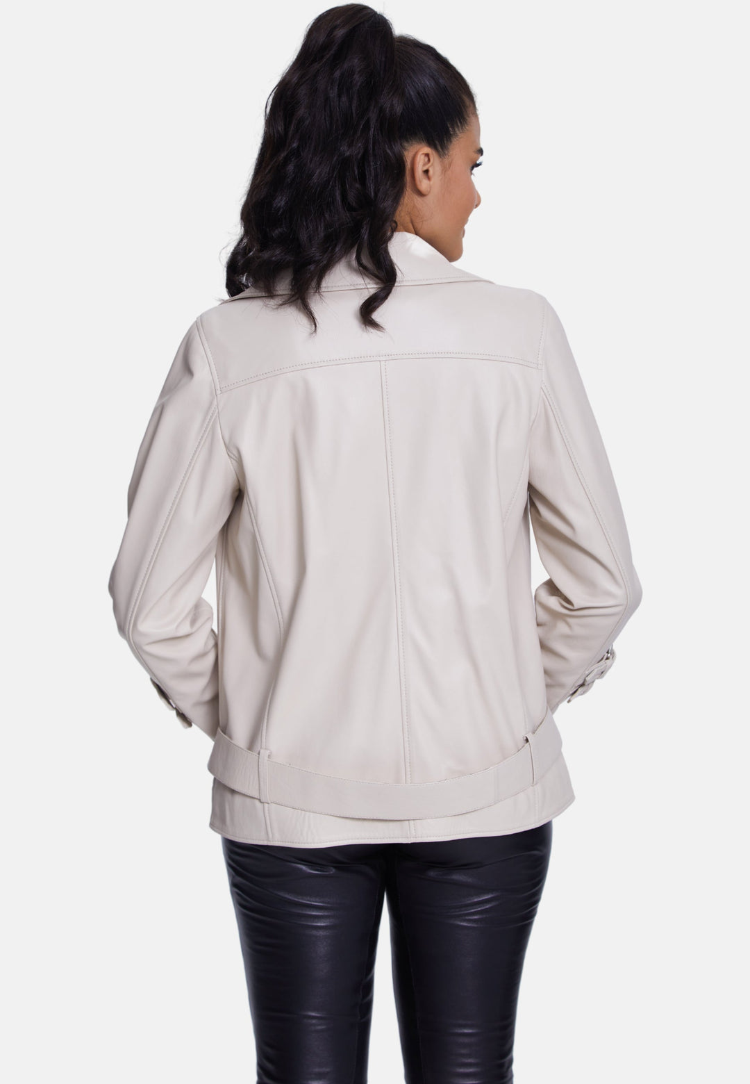 Woman wearing cream leather jacket (back)