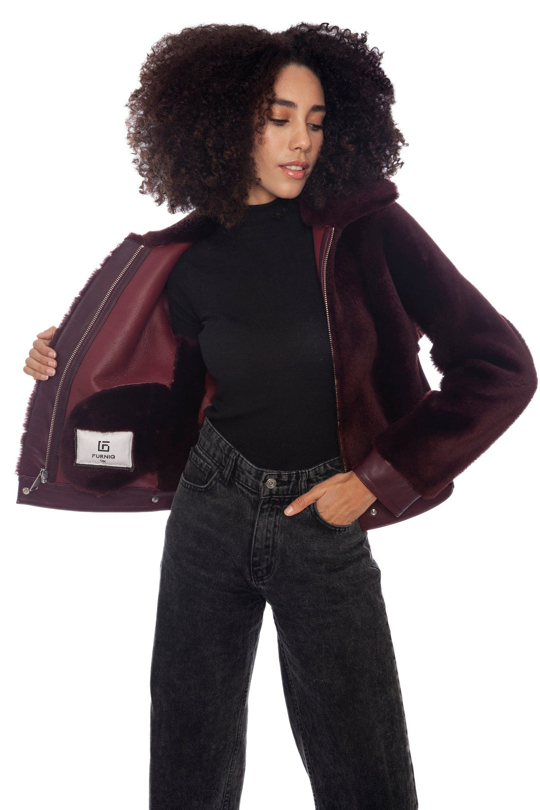 Woman wearing burgundy shearling jacket
