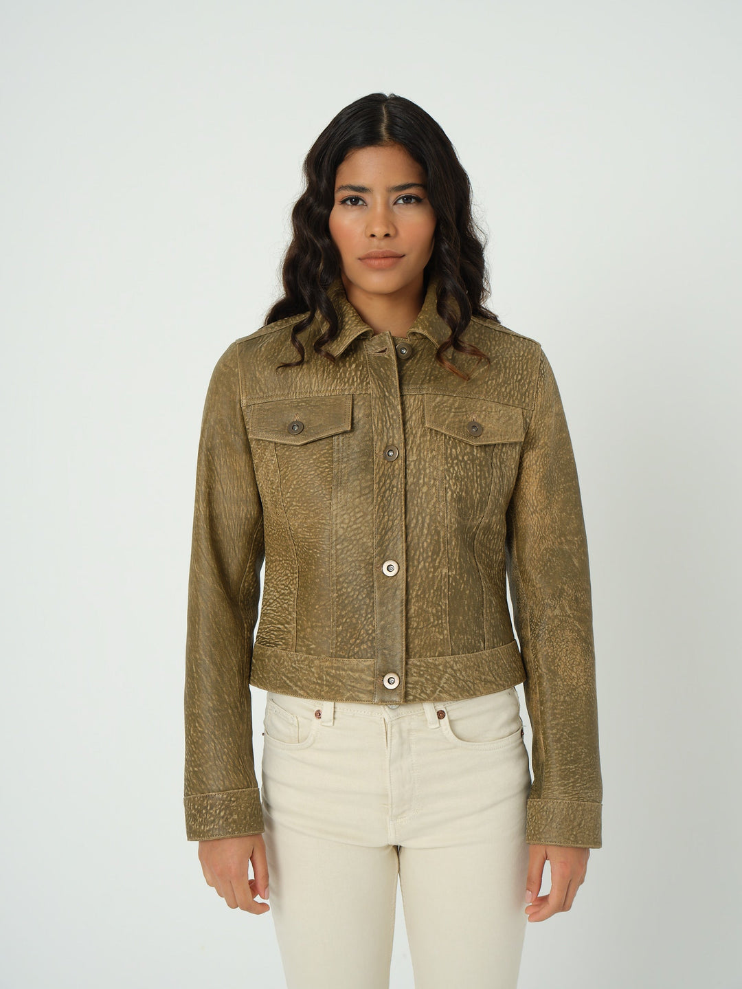 Woman wearing brown cropped leather jacket