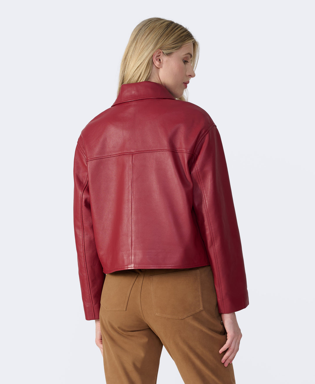 Woman wearing red leather jacket back view