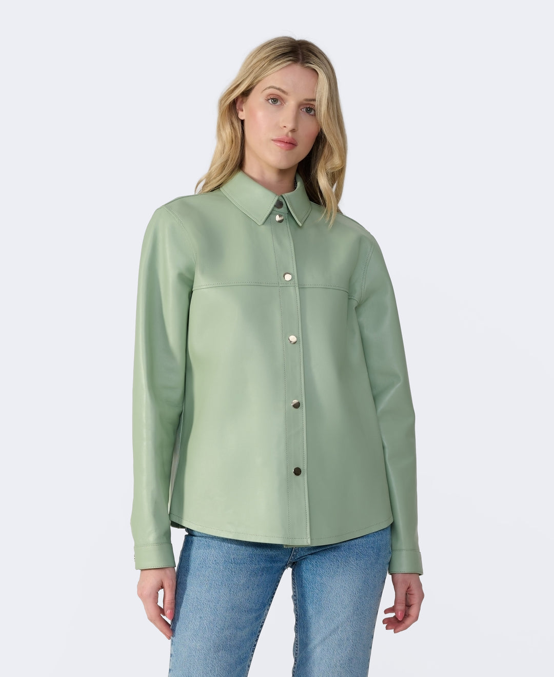 Sage green leather shirt jacket on model