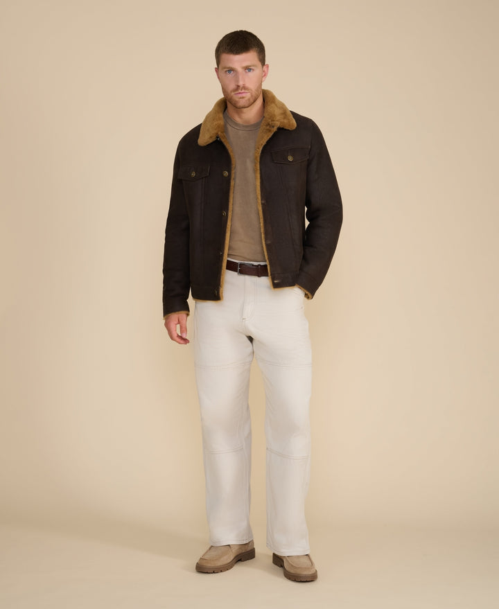 Man wearing dark brown shearling jacket