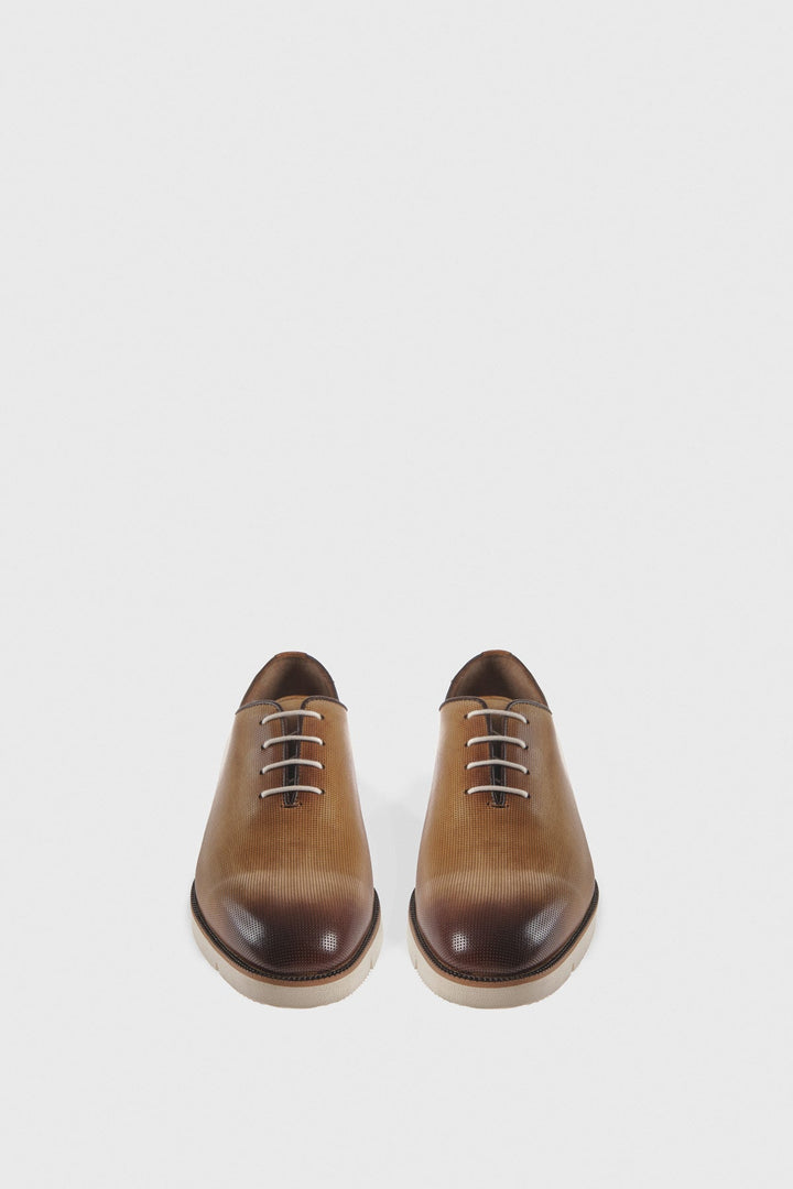Pair of tan leather men's shoes