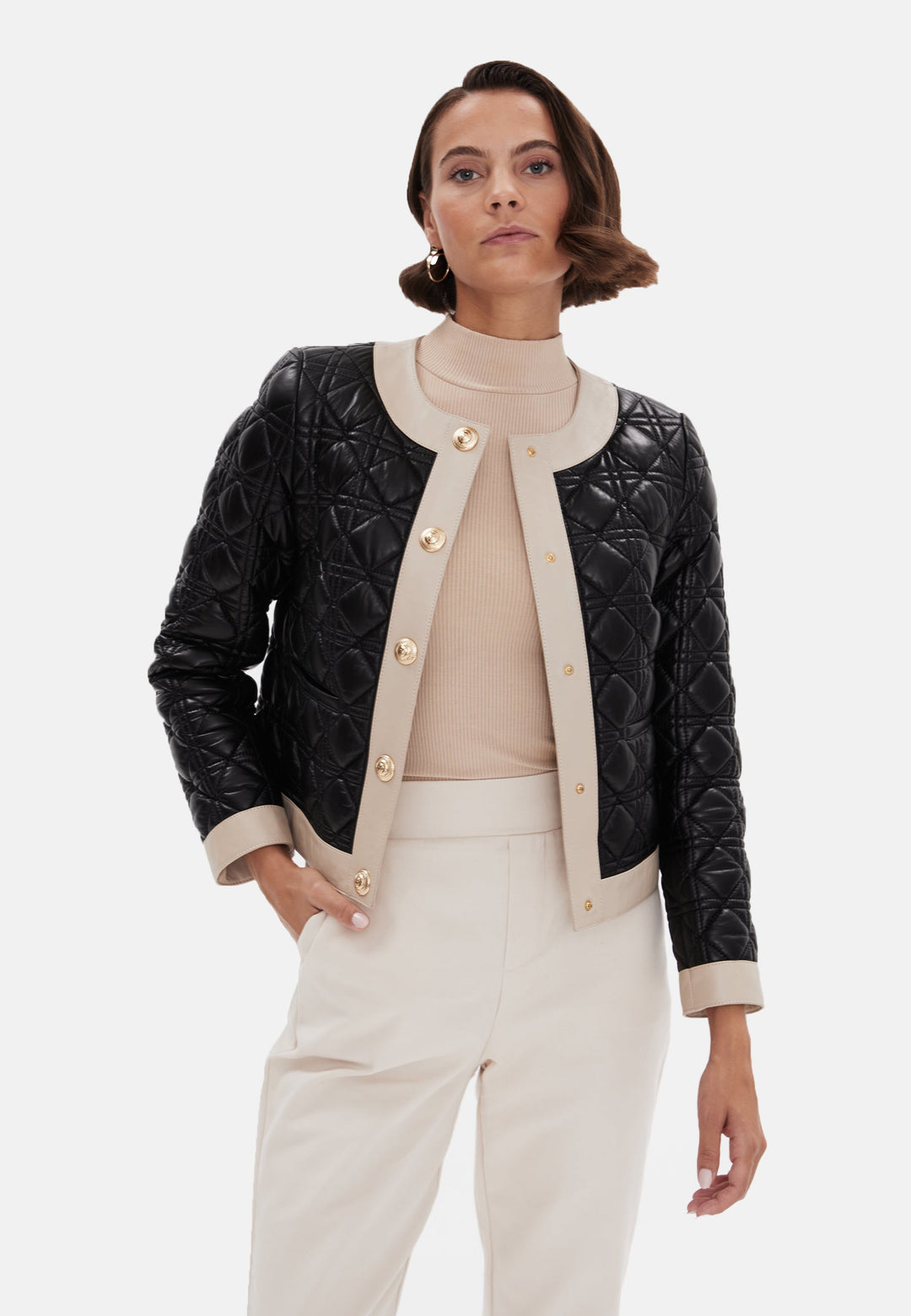 Woman wearing black quilted leather jacket