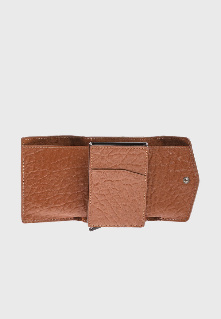 Tan leather wallet with elephant pattern