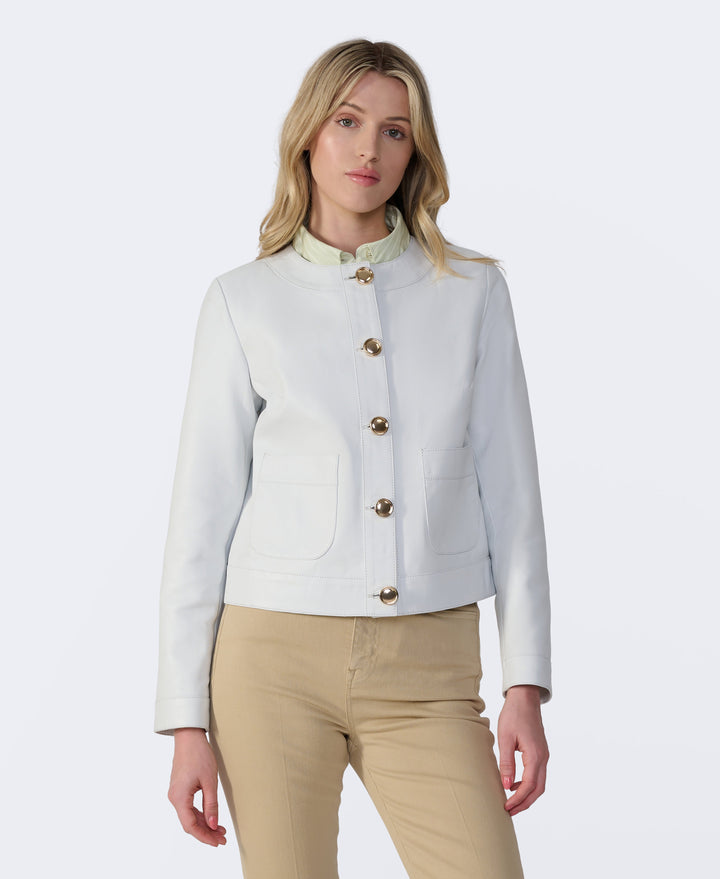 Woman wearing white leather jacket