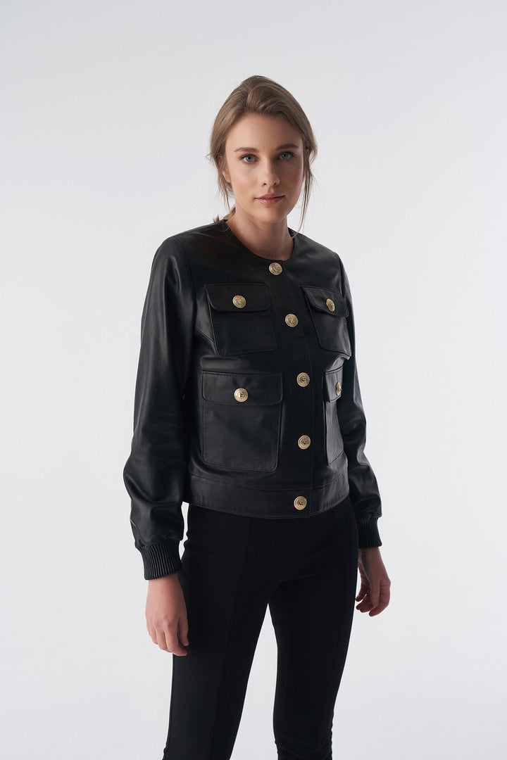 Woman wearing black leather jacket with buttons