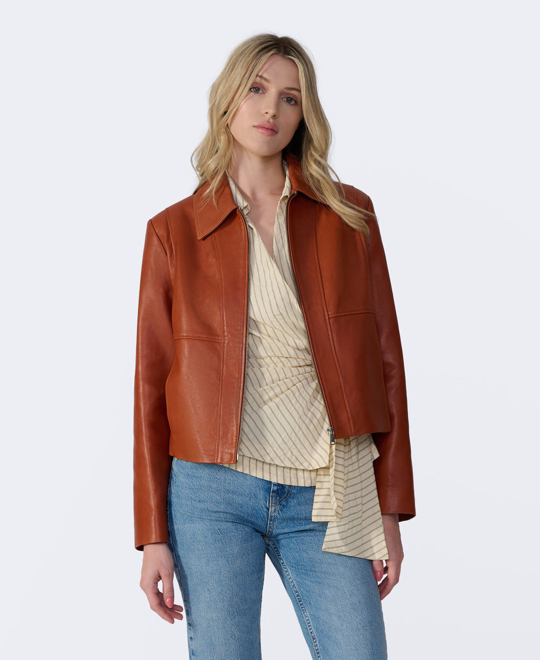 Model wearing rust leather jacket