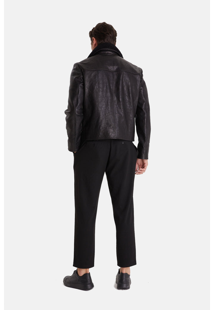 Man wearing black leather jacket back view