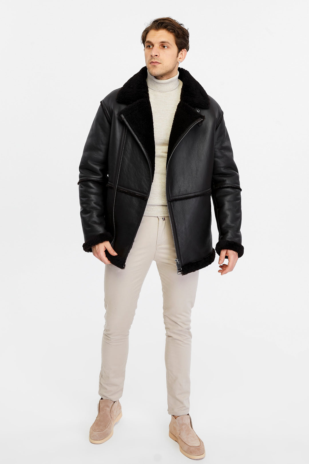 Male model wearing black shearling coat