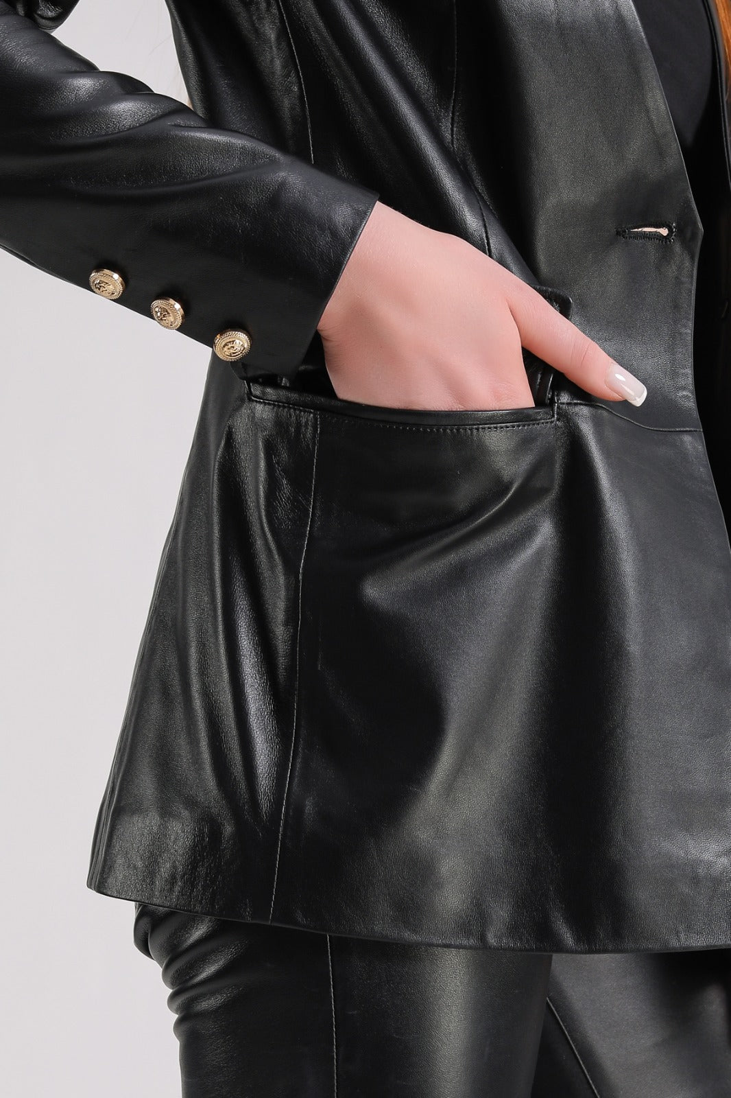Close-up of black leather jacket pocket