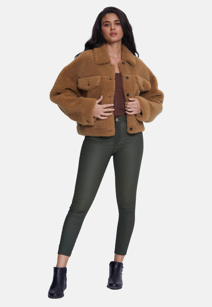 Woman in brown teddy jacket
