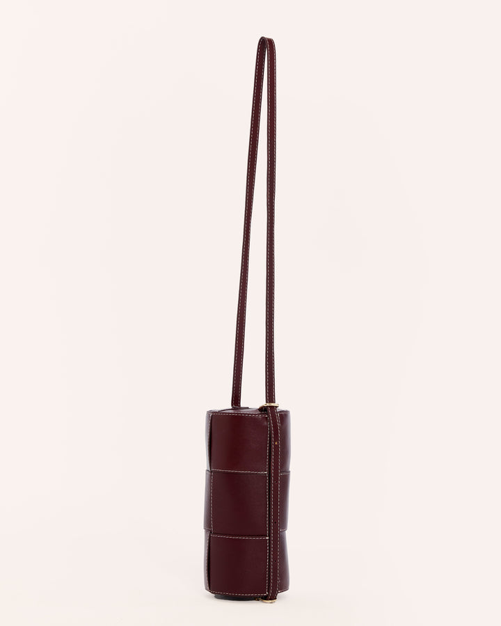 Burgundy leather shoulder bag with long strap