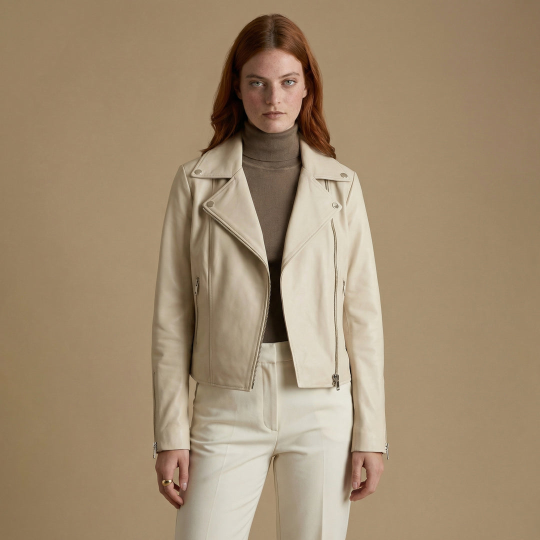 Women’s fitted beige leather jacket styled with neutral outfit – modern biker silhouette