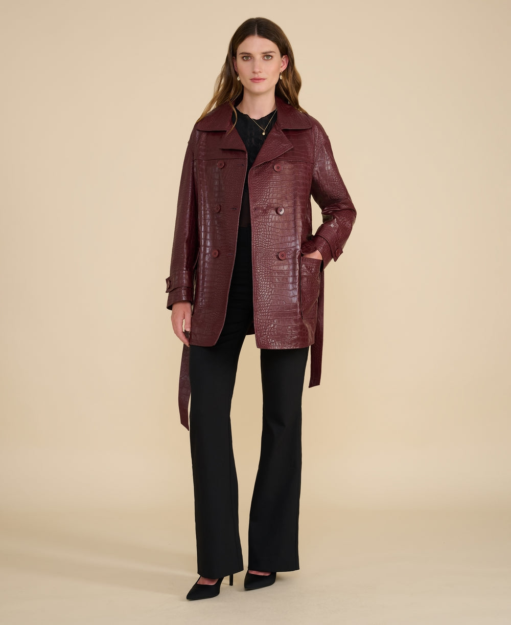 Women’s burgundy crocodile embossed leather trench coat with double-breasted front and waist belt
