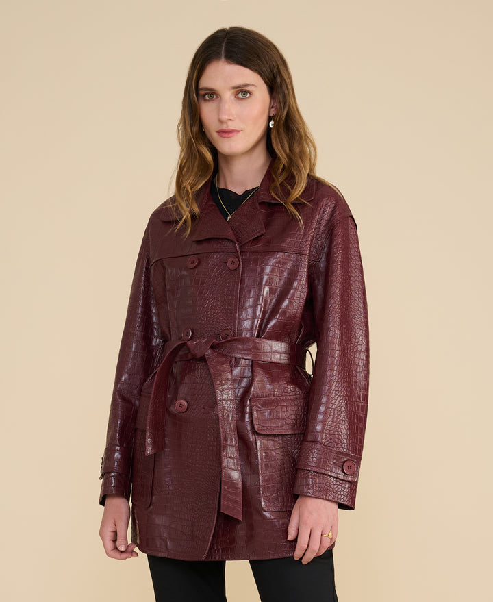 Pimlico women’s burgundy croc-embossed leather trench coat front view – short belted silhouette in 100% British leather