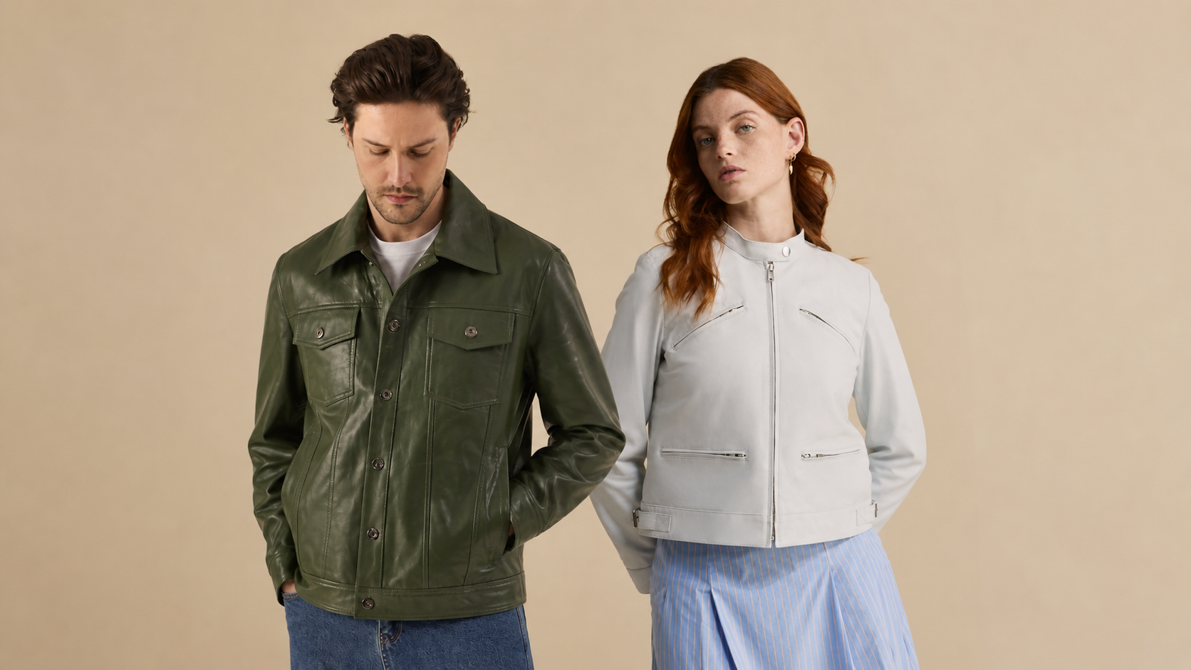 Two people wearing jackets against a beige background