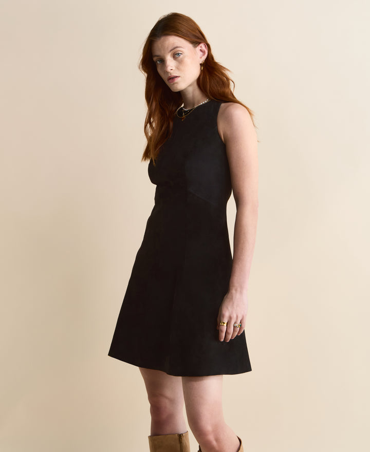 Side view of black suede A-line dress – modern sleeveless silhouette