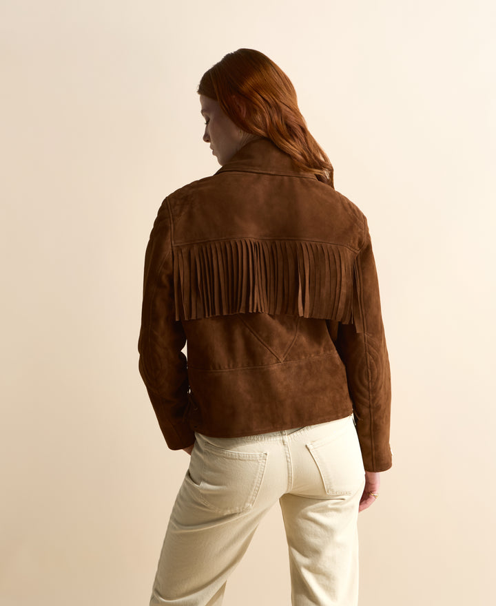 Back view of women’s chestnut fringe suede jacket